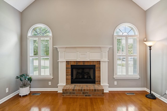 2707 Albany Ct, Murfreesboro, TN 37129 - unfurnished living room with hardwood / wood-style flooring, a fireplace, and high vaulted ceiling