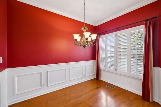 2707 Albany Ct, Murfreesboro, TN 37129 - unfurnished room with hardwood / wood-style flooring, a chandelier, wainscoting, and ornamental molding