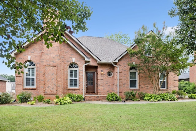 2707 Albany Ct, Murfreesboro, TN 37129 - view of front facade with brick siding, a front lawn, and roof with shingles