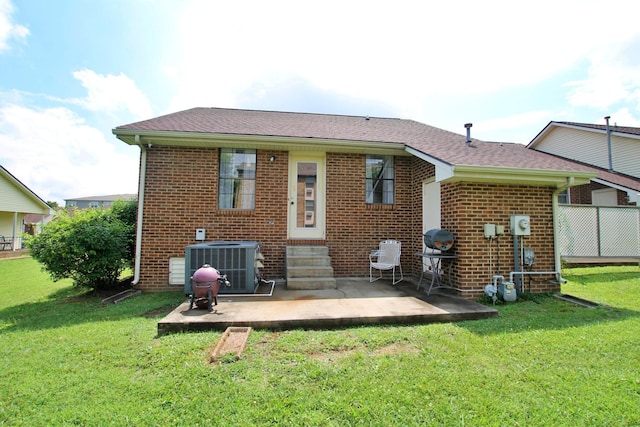 2117 Mockingbird Ln Unit A, Springfield, TN 37172 - back of property with entry steps, a patio, brick siding, and a lawn