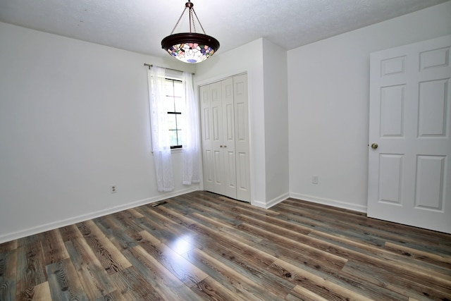2117 Mockingbird Ln Unit A, Springfield, TN 37172 - unfurnished bedroom with a closet and dark wood-type flooring
