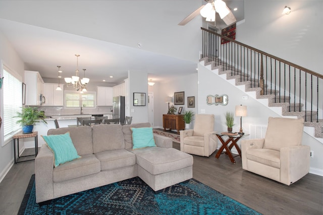 118 Colson Rd, Dover, TN 37058 - living room featuring dark wood-type flooring, stairs, ceiling fan, a chandelier, and recessed lighting