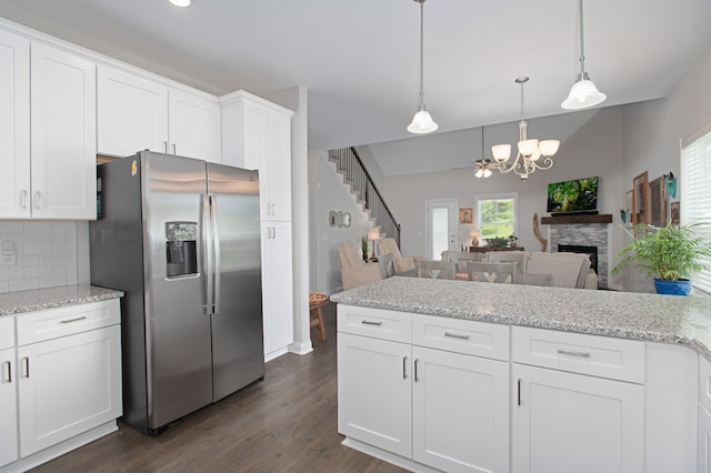 118 Colson Rd, Dover, TN 37058 - kitchen with stainless steel fridge with ice dispenser, a chandelier, backsplash, dark wood finished floors, and white cabinetry