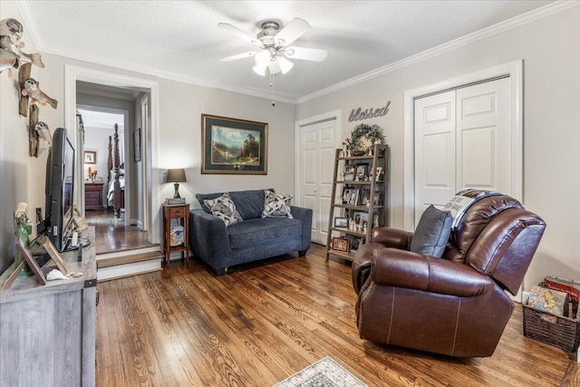 615 S Moore Rd, Chattanooga, TN 37412 - living room featuring wood finished floors, ceiling fan, and crown molding