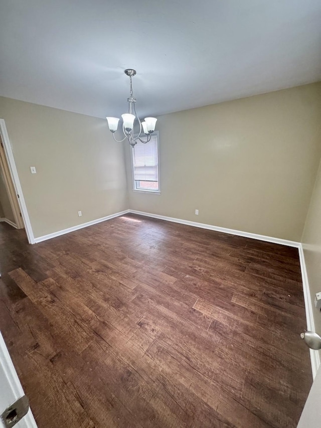 3084 Edgeware Rd S, Memphis, TN 38118 - empty room featuring a chandelier and dark wood-style flooring