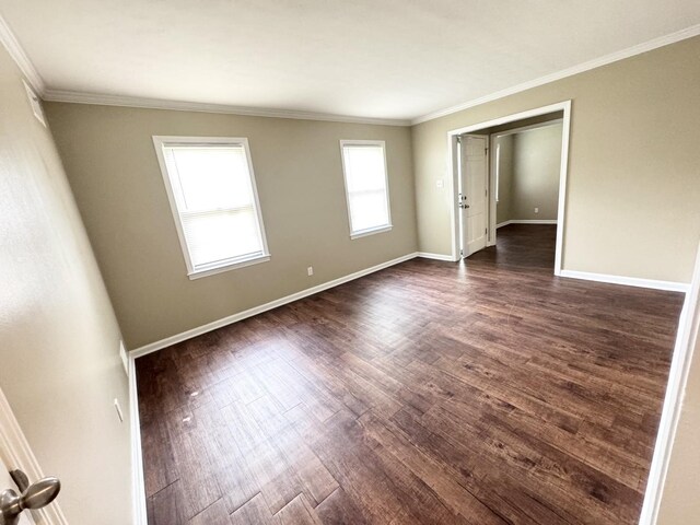 3084 Edgeware Rd S, Memphis, TN 38118 - empty room featuring dark wood-type flooring and ornamental molding