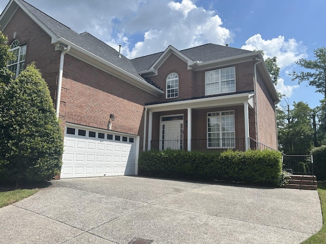 119 Belmont Cir, Hendersonville, TN 37075 - traditional home with brick siding, concrete driveway, and a porch