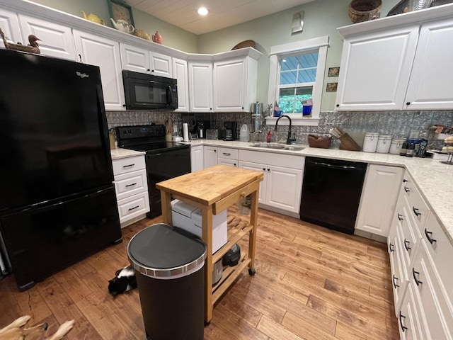 407 Cedar Rd, Pikeville, TN 37367 - kitchen featuring black appliances, recessed lighting, white cabinetry, and backsplash
