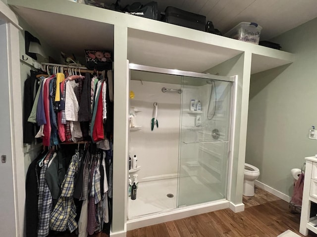 407 Cedar Rd, Pikeville, TN 37367 - full bath featuring wood finished floors, a stall shower, a spacious closet, and vanity