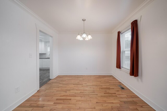 400 7th Ave, Fayetteville, TN 37334 - unfurnished room featuring a chandelier, light wood finished floors, and crown molding