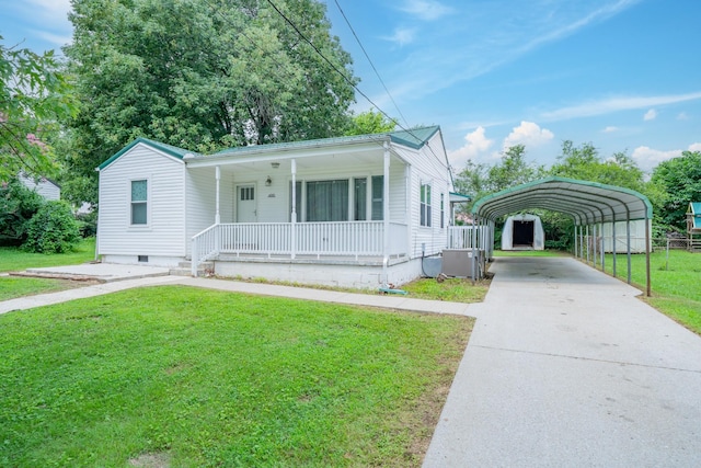 400 7th Ave, Fayetteville, TN 37334 - view of front facade featuring a detached carport, covered porch, a front lawn, concrete driveway, and crawl space