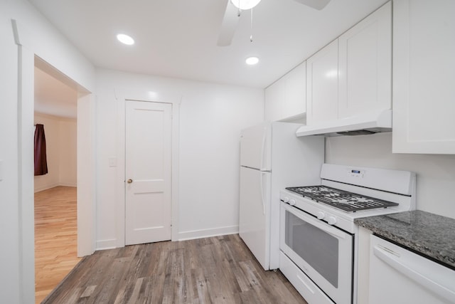 400 7th Ave, Fayetteville, TN 37334 - kitchen with white appliances, custom exhaust hood, light wood finished floors, white cabinets, and dark stone countertops