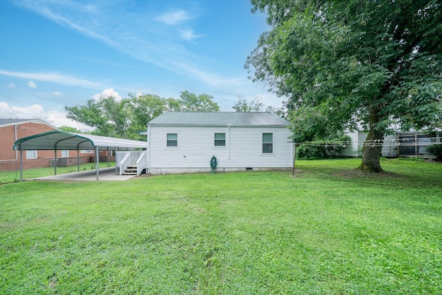 400 7th Ave, Fayetteville, TN 37334 - rear view of house featuring a detached carport and a metal roof