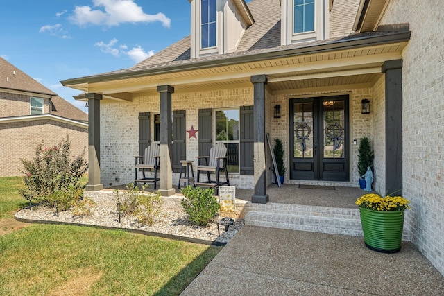 1111 Willow Springs Dr, Lebanon, TN 37087 - view of exterior entry with brick siding, covered porch, and roof with shingles