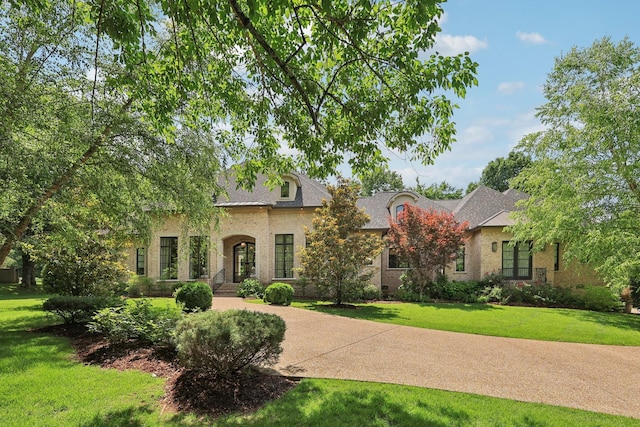 3 Annandale, Nashville, TN 37215 - french country style house featuring a front yard and brick siding
