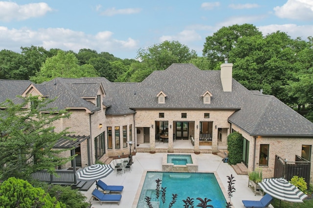 3 Annandale, Nashville, TN 37215 - rear view of house with brick siding, a chimney, french doors, a patio, and a pool with connected hot tub