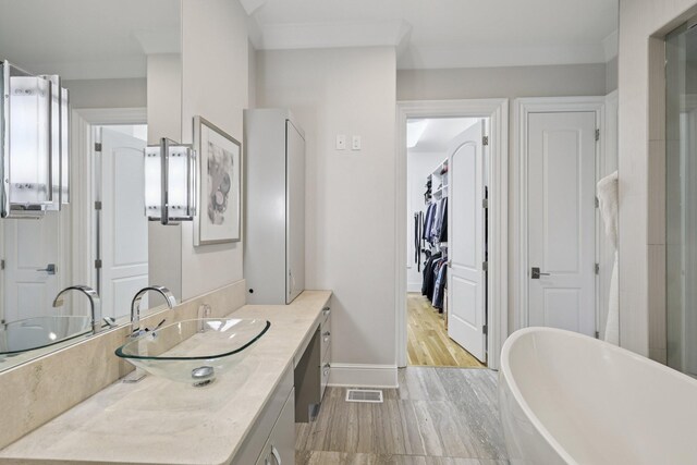 3 Annandale, Nashville, TN 37215 - full bathroom featuring vanity, a freestanding tub, and wood finished floors