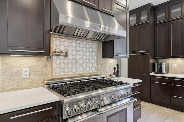 3 Annandale, Nashville, TN 37215 - kitchen featuring high end stainless steel range oven, under cabinet range hood, light countertops, and backsplash
