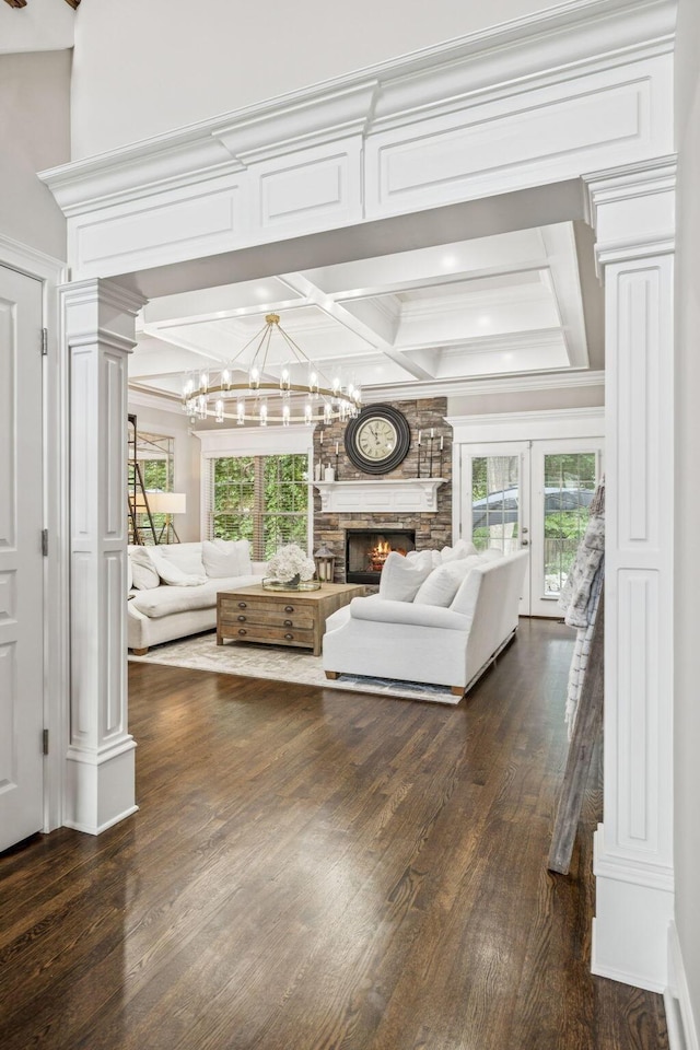 1808 Mosaic Trl, Murfreesboro, TN 37130 - living room featuring a chandelier, dark wood finished floors, decorative columns, a fireplace, and ornamental molding