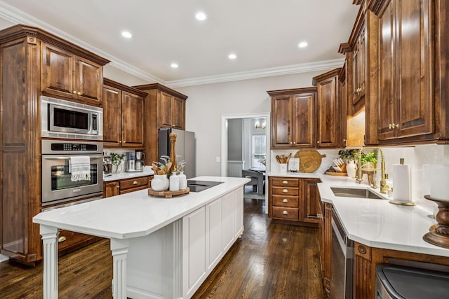 1808 Mosaic Trl, Murfreesboro, TN 37130 - kitchen featuring appliances with stainless steel finishes, dark wood finished floors, crown molding, a center island with sink, and recessed lighting