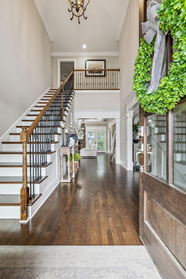 1808 Mosaic Trl, Murfreesboro, TN 37130 - foyer entrance with stairway, ornamental molding, a chandelier, wood finished floors, and a high ceiling