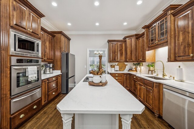 1808 Mosaic Trl, Murfreesboro, TN 37130 - kitchen with stainless steel appliances, a warming drawer, dark wood-style flooring, crown molding, and a kitchen island