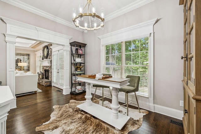 1808 Mosaic Trl, Murfreesboro, TN 37130 - dining space featuring a stone fireplace, crown molding, ornate columns, dark wood-type flooring, and a chandelier