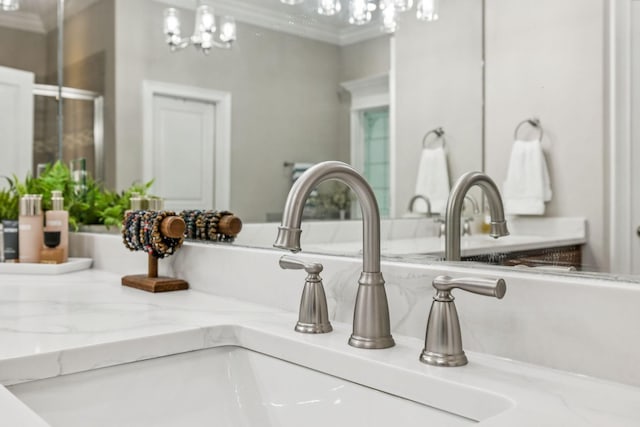 1808 Mosaic Trl, Murfreesboro, TN 37130 - bathroom view of crown molding, vanity, and a chandelier