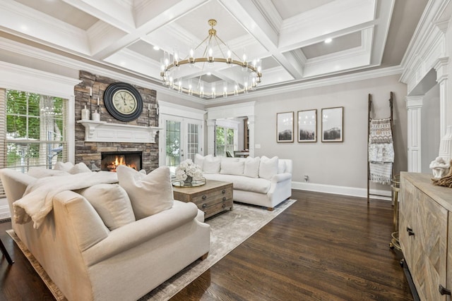 1808 Mosaic Trl, Murfreesboro, TN 37130 - living area featuring healthy amount of natural light, a stone fireplace, a chandelier, ornamental molding, and dark wood-style flooring