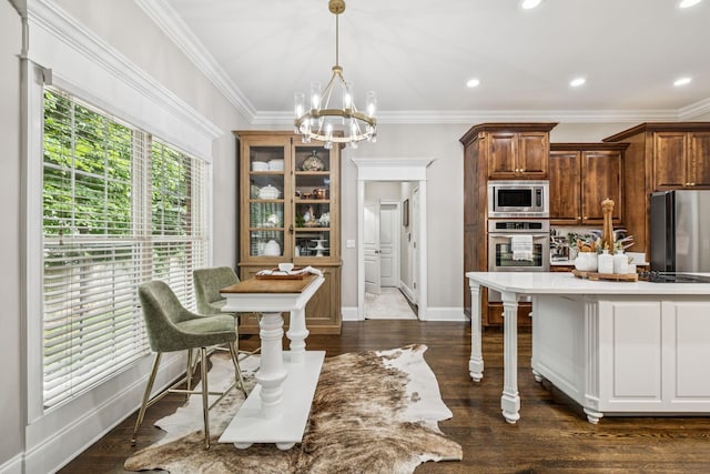 1808 Mosaic Trl, Murfreesboro, TN 37130 - kitchen with appliances with stainless steel finishes, a chandelier, crown molding, hanging light fixtures, and light countertops