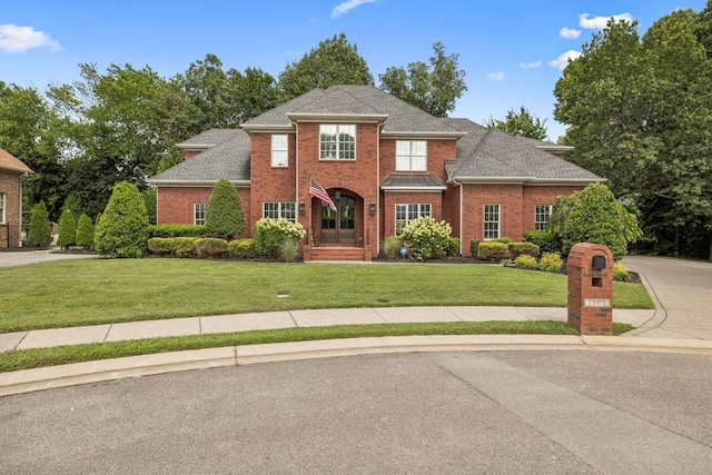 1808 Mosaic Trl, Murfreesboro, TN 37130 - traditional-style home featuring brick siding, a front lawn, and a shingled roof