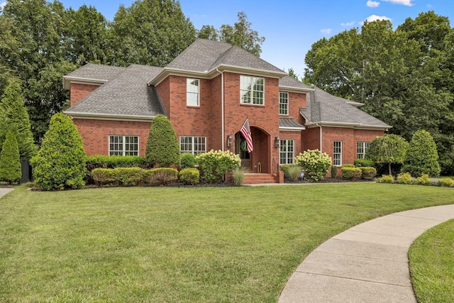 1808 Mosaic Trl, Murfreesboro, TN 37130 - view of front of home with brick siding, a front lawn, and roof with shingles