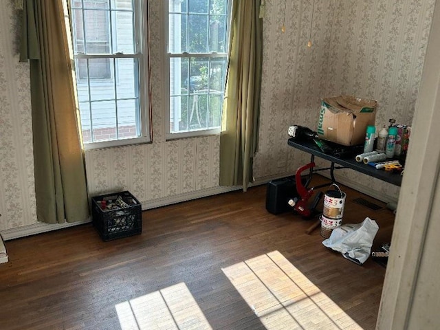 122 W Lake St, Camden, TN 38320 - misc room with wallpapered walls and wood finished floors