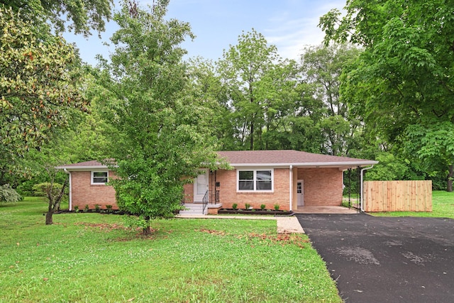 101 Arnold Ln, Murfreesboro, TN 37127 - ranch-style home featuring driveway, brick siding, and a carport