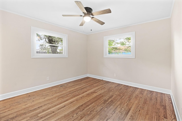 101 Arnold Ln, Murfreesboro, TN 37127 - unfurnished room with healthy amount of natural light, ornamental molding, wood finished floors, and a ceiling fan