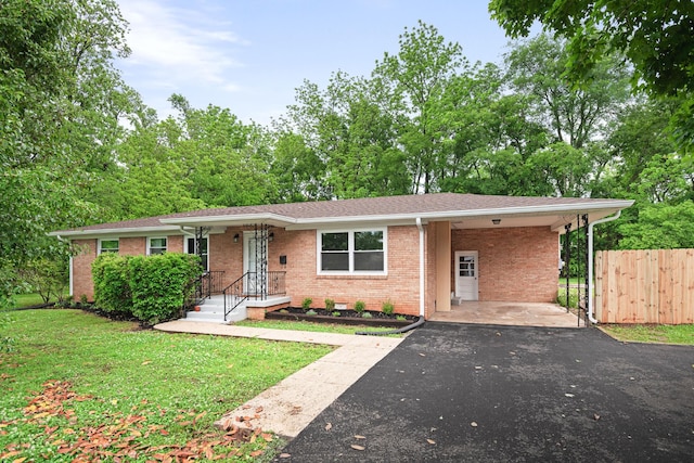 101 Arnold Ln, Murfreesboro, TN 37127 - ranch-style house featuring driveway, a carport, brick siding, and a shingled roof