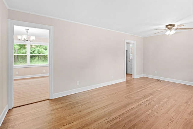 101 Arnold Ln, Murfreesboro, TN 37127 - spare room featuring ornamental molding, a chandelier, light wood-style floors, and a ceiling fan