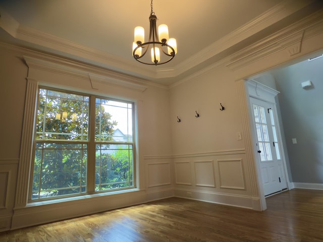 5120 Prickly Pine Pl, Murfreesboro, TN 37129 - unfurnished dining area featuring healthy amount of natural light, a chandelier, dark wood-type flooring, ornamental molding, and wainscoting