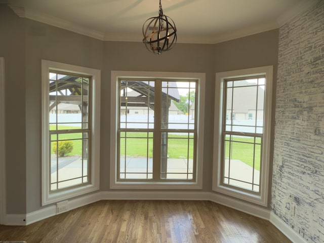 5120 Prickly Pine Pl, Murfreesboro, TN 37129 - unfurnished dining area featuring plenty of natural light, a chandelier, dark wood-type flooring, and ornamental molding