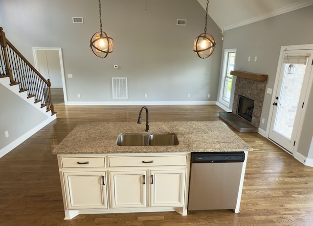 5120 Prickly Pine Pl, Murfreesboro, TN 37129 - kitchen featuring stainless steel dishwasher, open floor plan, crown molding, light stone countertops, and pendant lighting