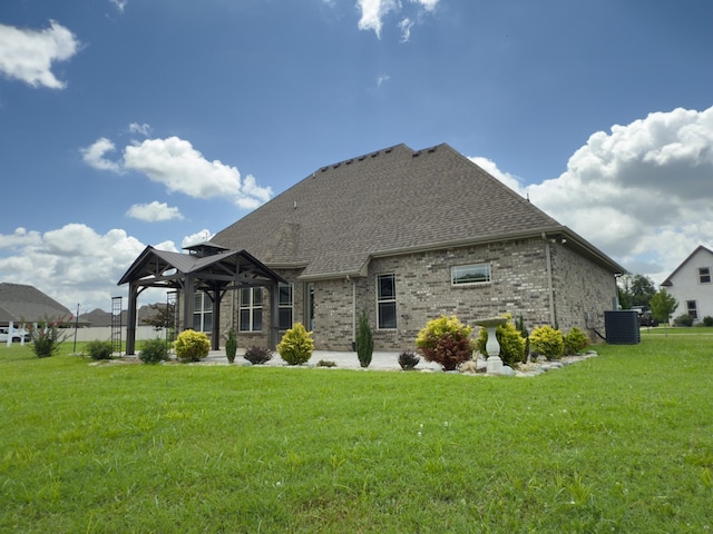 5120 Prickly Pine Pl, Murfreesboro, TN 37129 - rear view of house featuring a gazebo, a lawn, brick siding, and a shingled roof