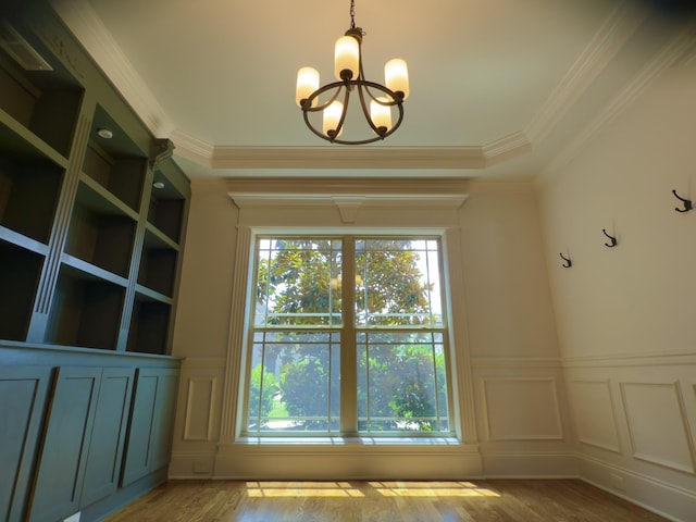 5120 Prickly Pine Pl, Murfreesboro, TN 37129 - empty room with a decorative wall, wood finished floors, a chandelier, a wainscoted wall, and ornamental molding
