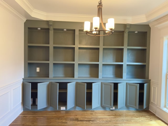 5120 Prickly Pine Pl, Murfreesboro, TN 37129 - unfurnished dining area with ornamental molding, a chandelier, light wood-style flooring, a decorative wall, and wainscoting