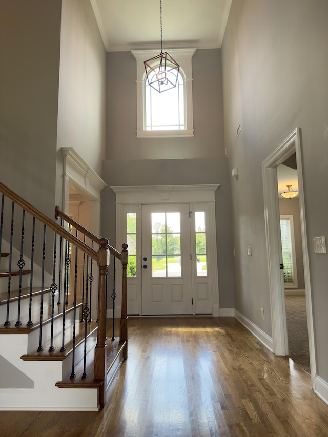 5120 Prickly Pine Pl, Murfreesboro, TN 37129 - entryway with a high ceiling, wood finished floors, stairs, crown molding, and a chandelier