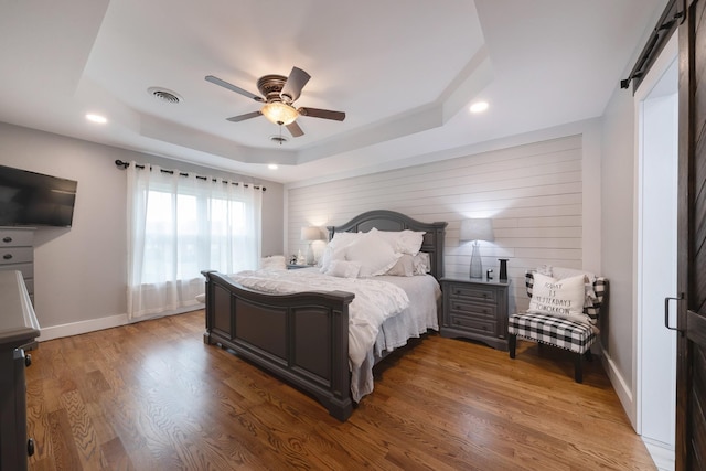 114 Deerview Dr, Columbia, TN 38401 - bedroom with a tray ceiling, wood finished floors, recessed lighting, and ceiling fan