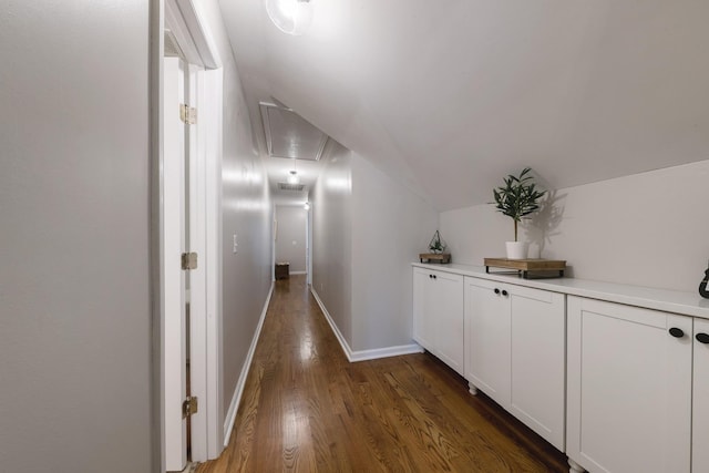 114 Deerview Dr, Columbia, TN 38401 - hallway featuring attic access, vaulted ceiling, and dark wood-type flooring