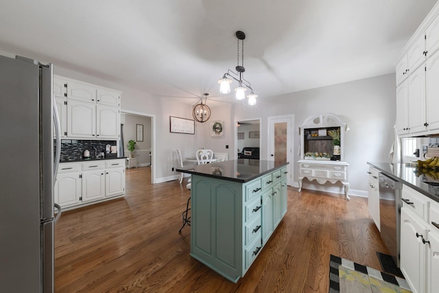 114 Deerview Dr, Columbia, TN 38401 - kitchen with appliances with stainless steel finishes, dark countertops, and white cabinetry