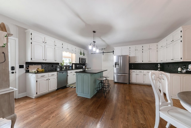 114 Deerview Dr, Columbia, TN 38401 - kitchen featuring appliances with stainless steel finishes, dark countertops, white cabinets, and backsplash