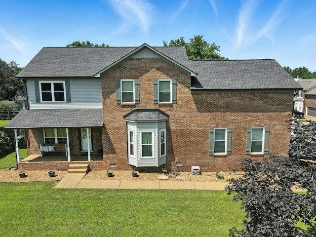 114 Deerview Dr, Columbia, TN 38401 - view of front of property featuring a shingled roof, brick siding, a front lawn, and covered porch