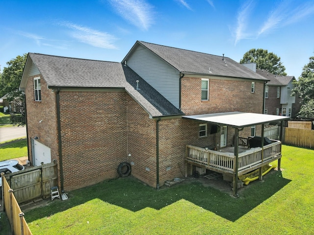 114 Deerview Dr, Columbia, TN 38401 - back of house featuring a wooden deck, a fenced backyard, brick siding, and a shingled roof